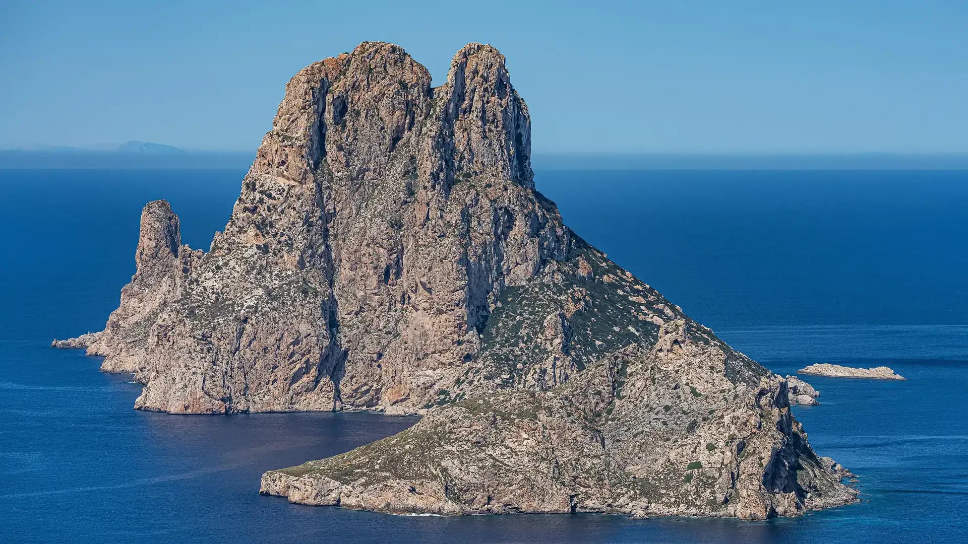 Es Vedrà rock formation rising from the Mediterranean sea, Ibiza, Spain